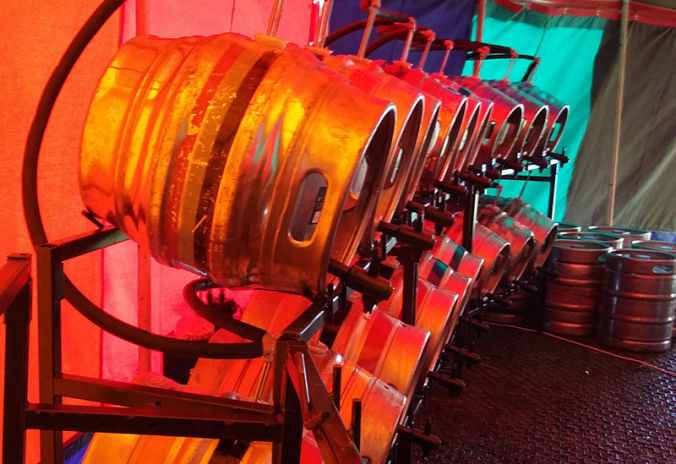 stocked bar with beer kegs